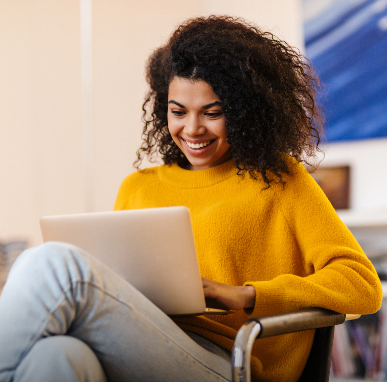 Woman in yellow dress using laptop Woman in yellow dress using laptop